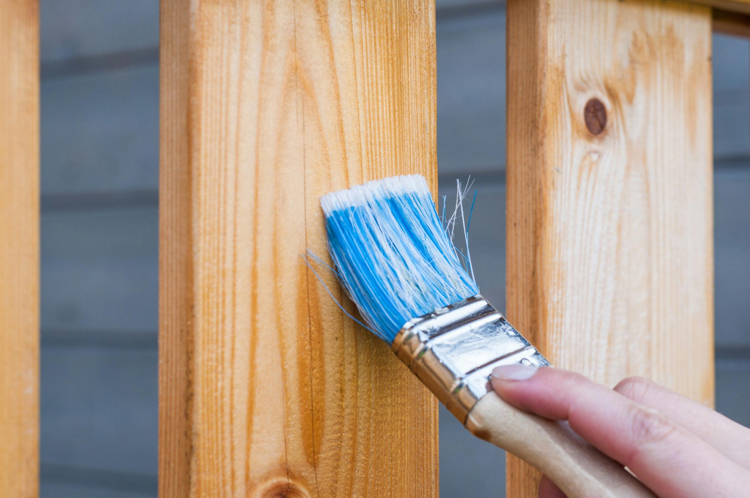 Deck board being stained